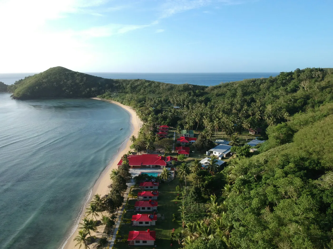 Aerial view of a coastal village with built infrastructure